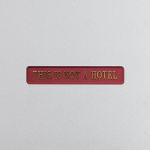 "THIS IS NOT A HOTEL" Red/Gold