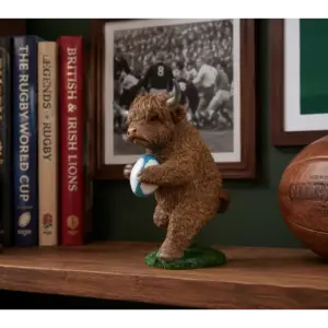 Highland Cow With Rugby Ball